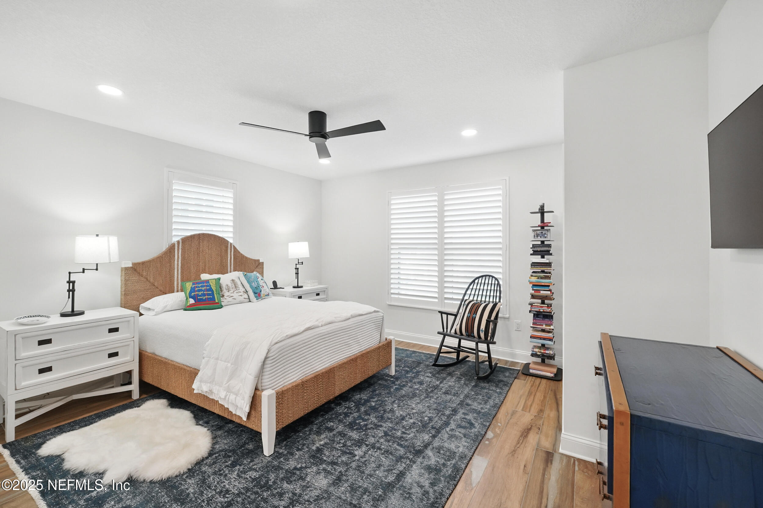 1505 1st Street South, Unit 302 Jacksonville Beach, FL 32250 - Photo 35 of 57 a bedroom with a bed and a flat screen tv