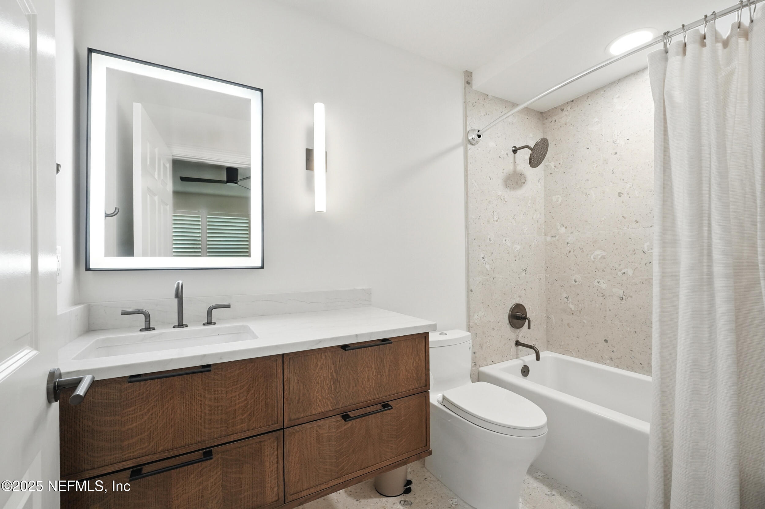 1505 1st Street South, Unit 302 Jacksonville Beach, FL 32250 - Photo 40 of 57 a bathroom with a sink a toilet and shower
