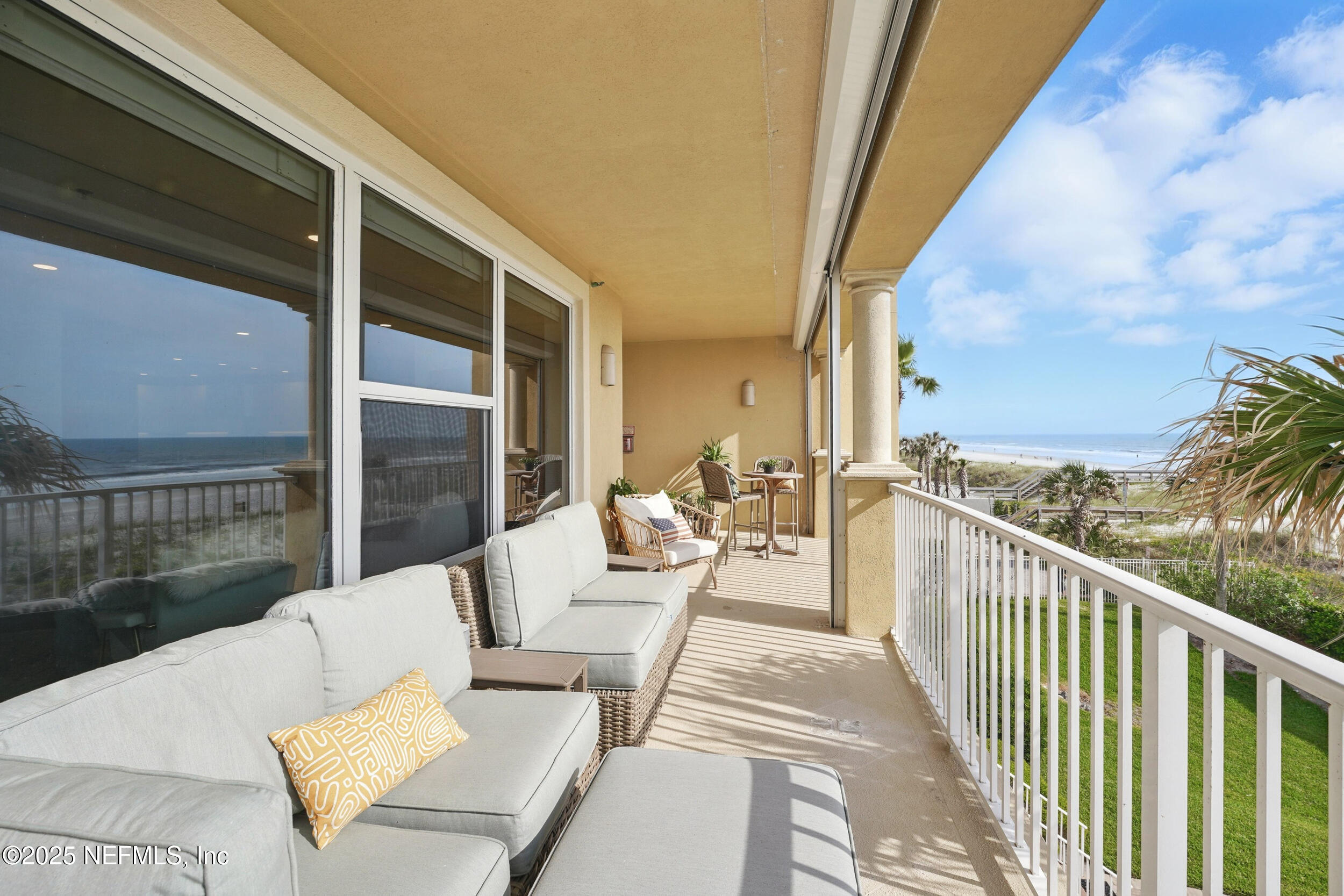 1505 1st Street South, Unit 302 Jacksonville Beach, FL 32250 - Photo 43 of 57 a view of balcony with couches and wooden floor