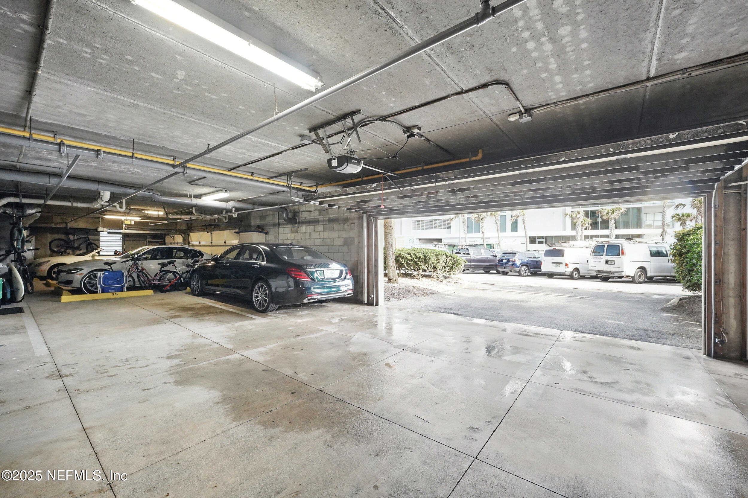 1505 1st Street South, Unit 302 Jacksonville Beach, FL 32250 - Photo 47 of 57 a view of parking garage with cars