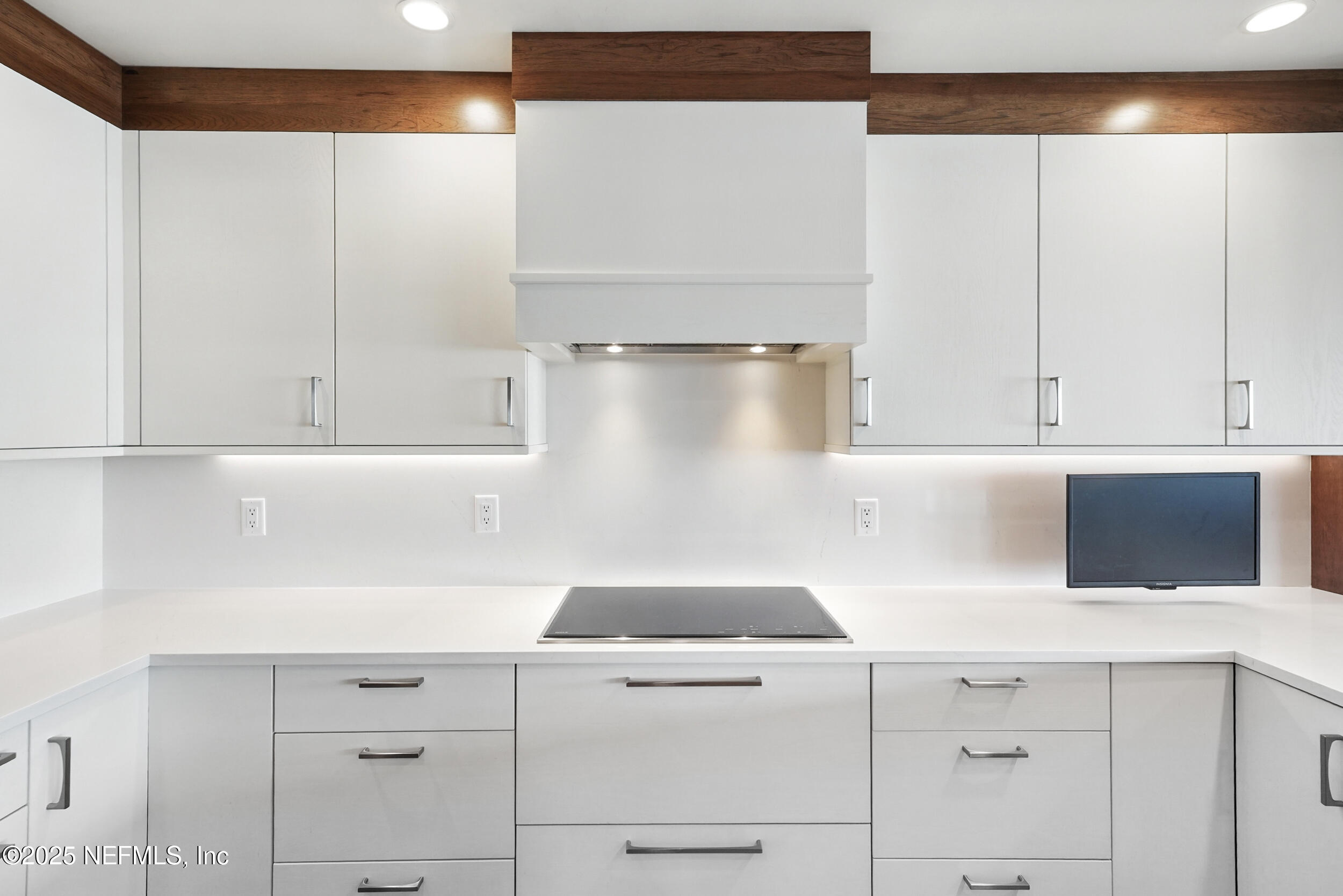 1505 1st Street South, Unit 302 Jacksonville Beach, FL 32250 - Photo 10 of 57 a kitchen with a white cabinets and white appliances