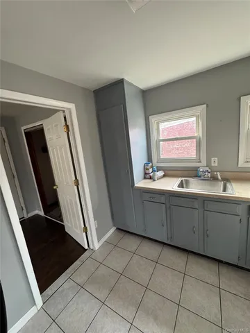 a bathroom with a sink a mirror and a bathtub