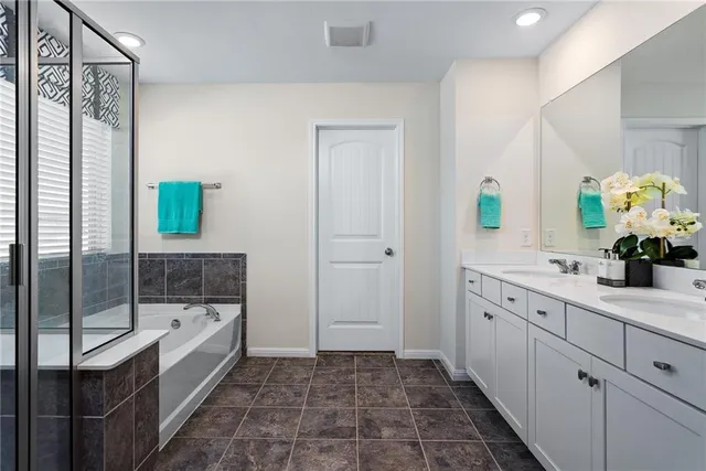 a bathroom with a bathtub and a sink