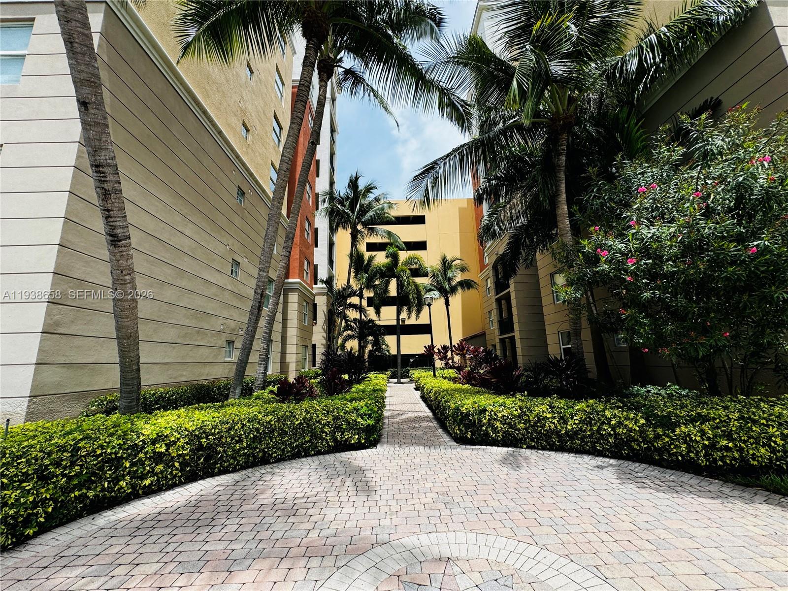 17150 North Bay Road, Unit 2412 Sunny Isles Beach, FL 33160 - Photo 12 of 25 a front view of a house with a garden
