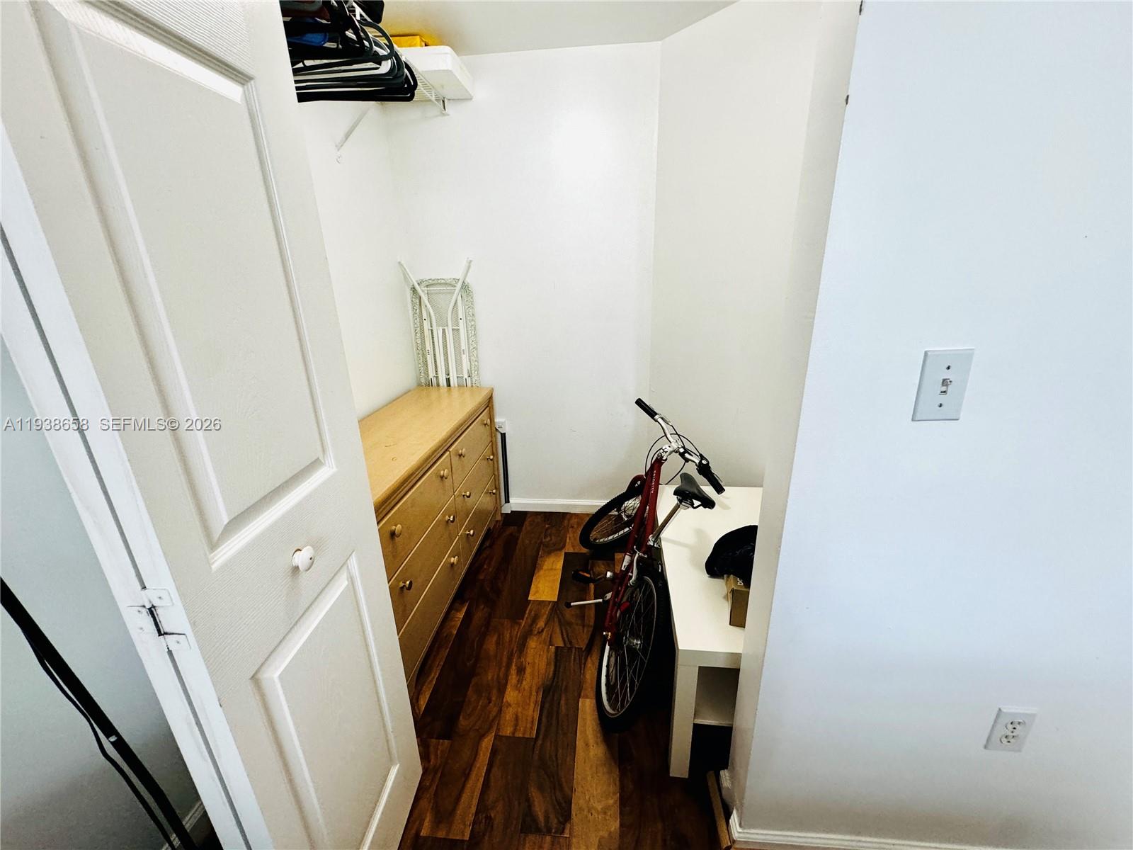 17150 North Bay Road, Unit 2412 Sunny Isles Beach, FL 33160 - Photo 13 of 29 a view of walk in closet with clothes and shoes