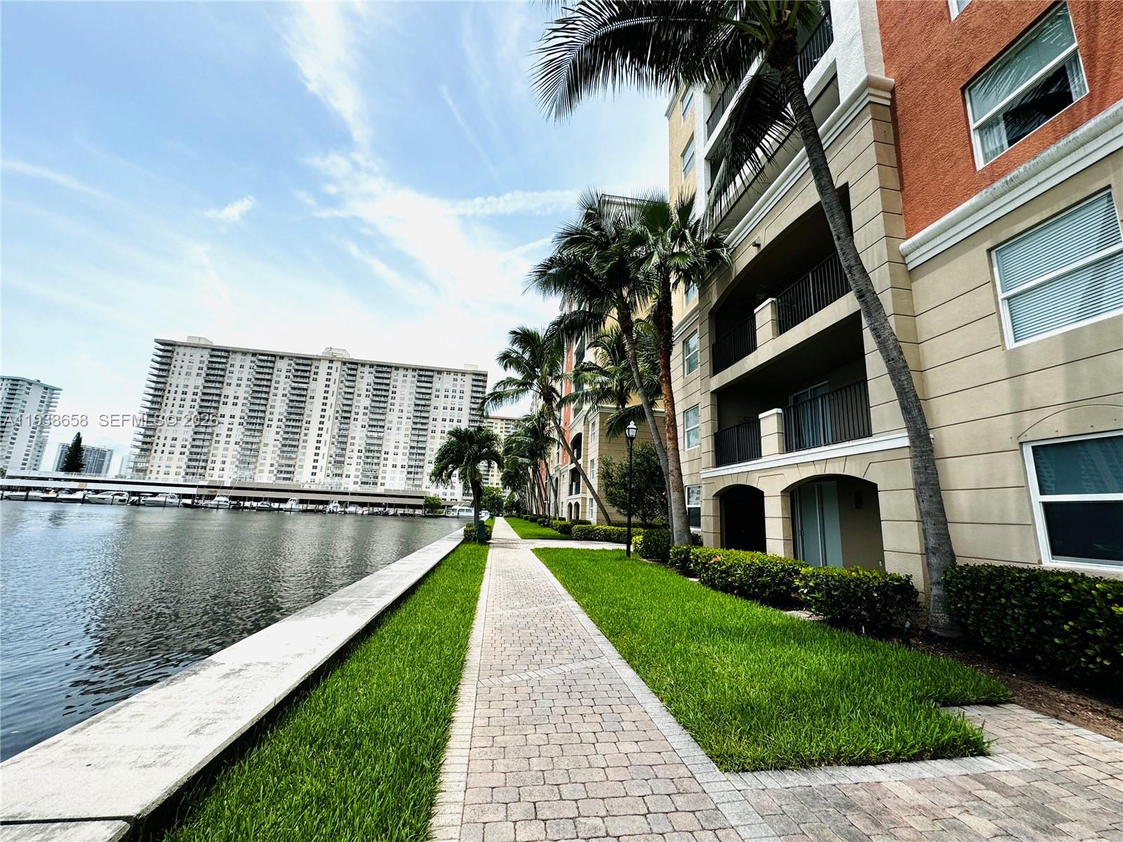 17150 North Bay Road, Unit 2412 Sunny Isles Beach, FL 33160 - Photo 17 of 29 a view of a swimming pool with a garden