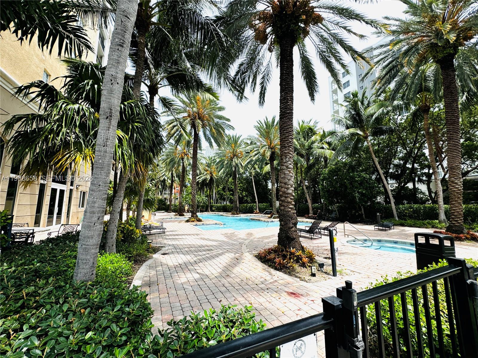 17150 North Bay Road, Unit 2412 Sunny Isles Beach, FL 33160 - Photo 20 of 29 a view of a yard with palm trees