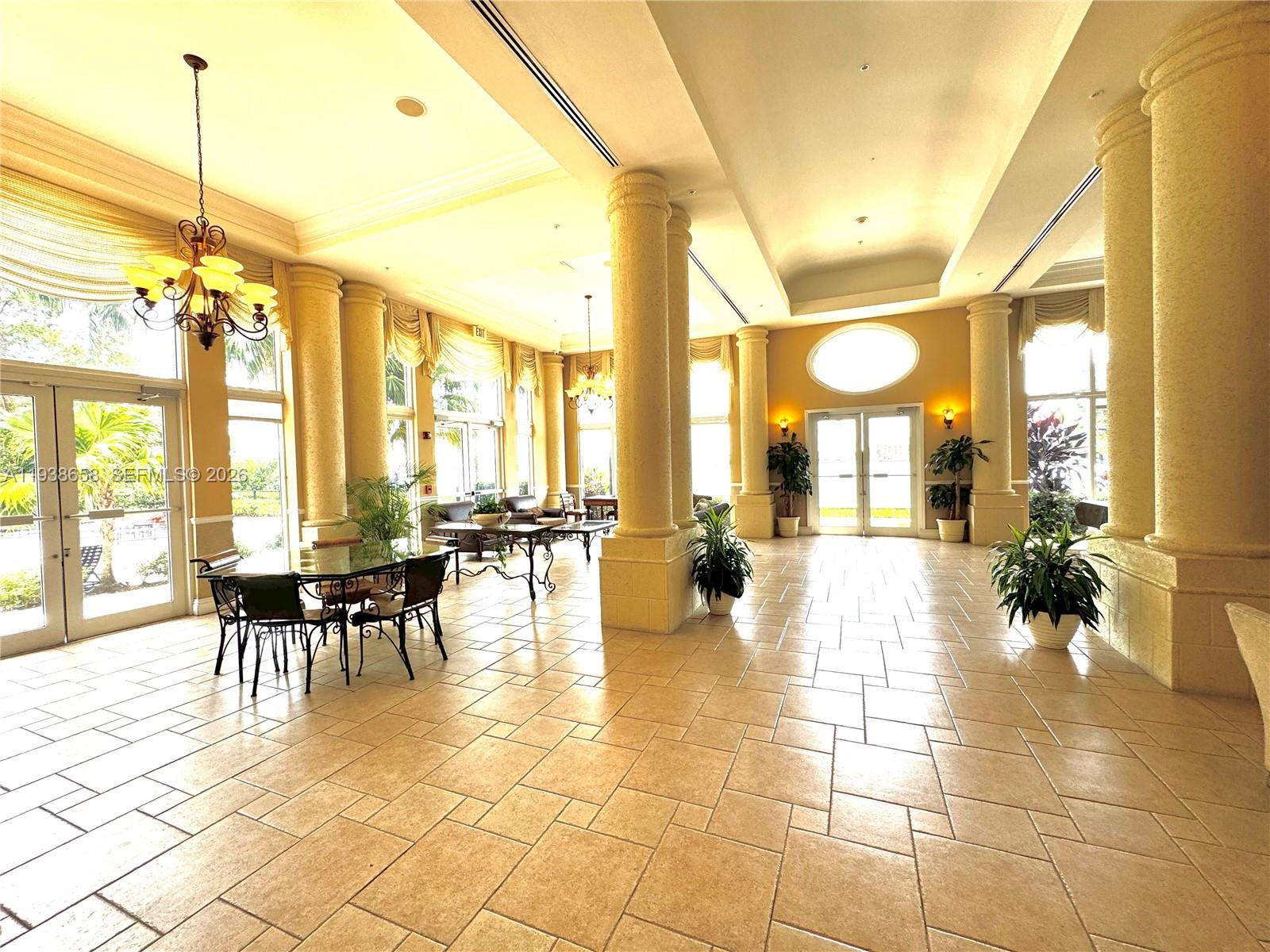 17150 North Bay Road, Unit 2412 Sunny Isles Beach, FL 33160 - Photo 25 of 29 a view of a dining hall with lots of tables and chairs