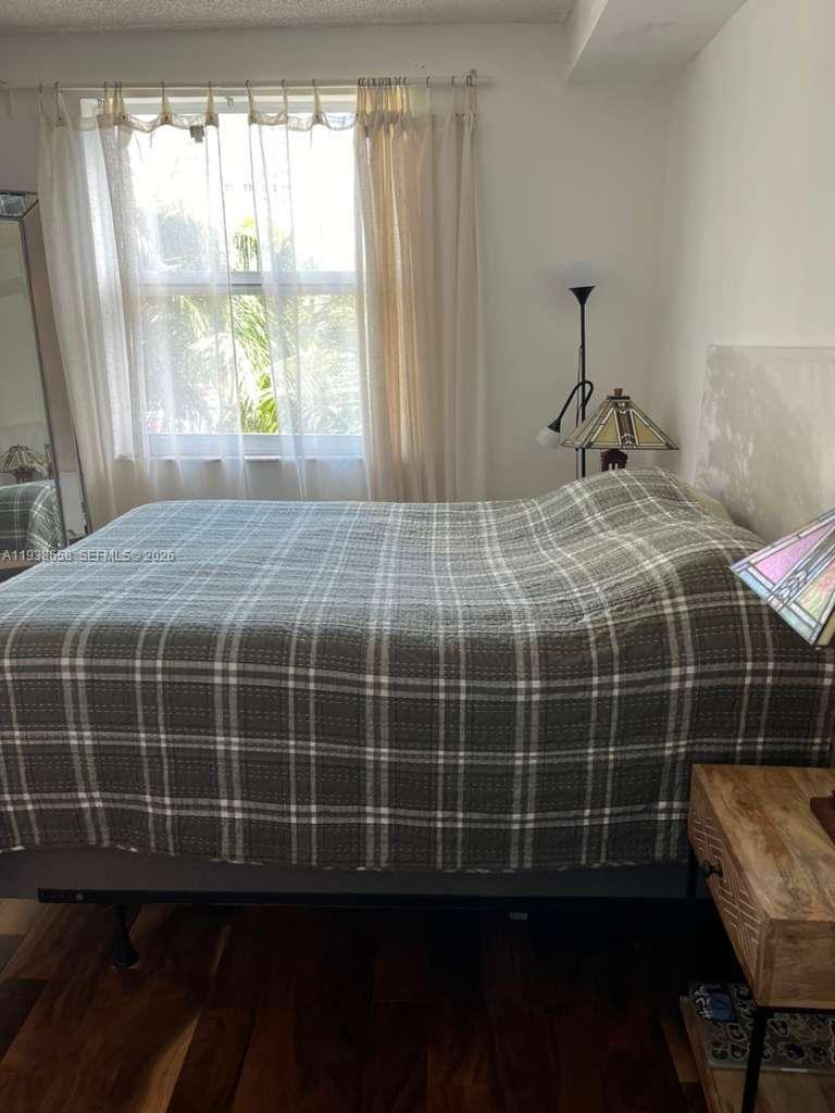 17150 North Bay Road, Unit 2412 Sunny Isles Beach, FL 33160 - Photo 5 of 25 a bedroom with a bed and a window