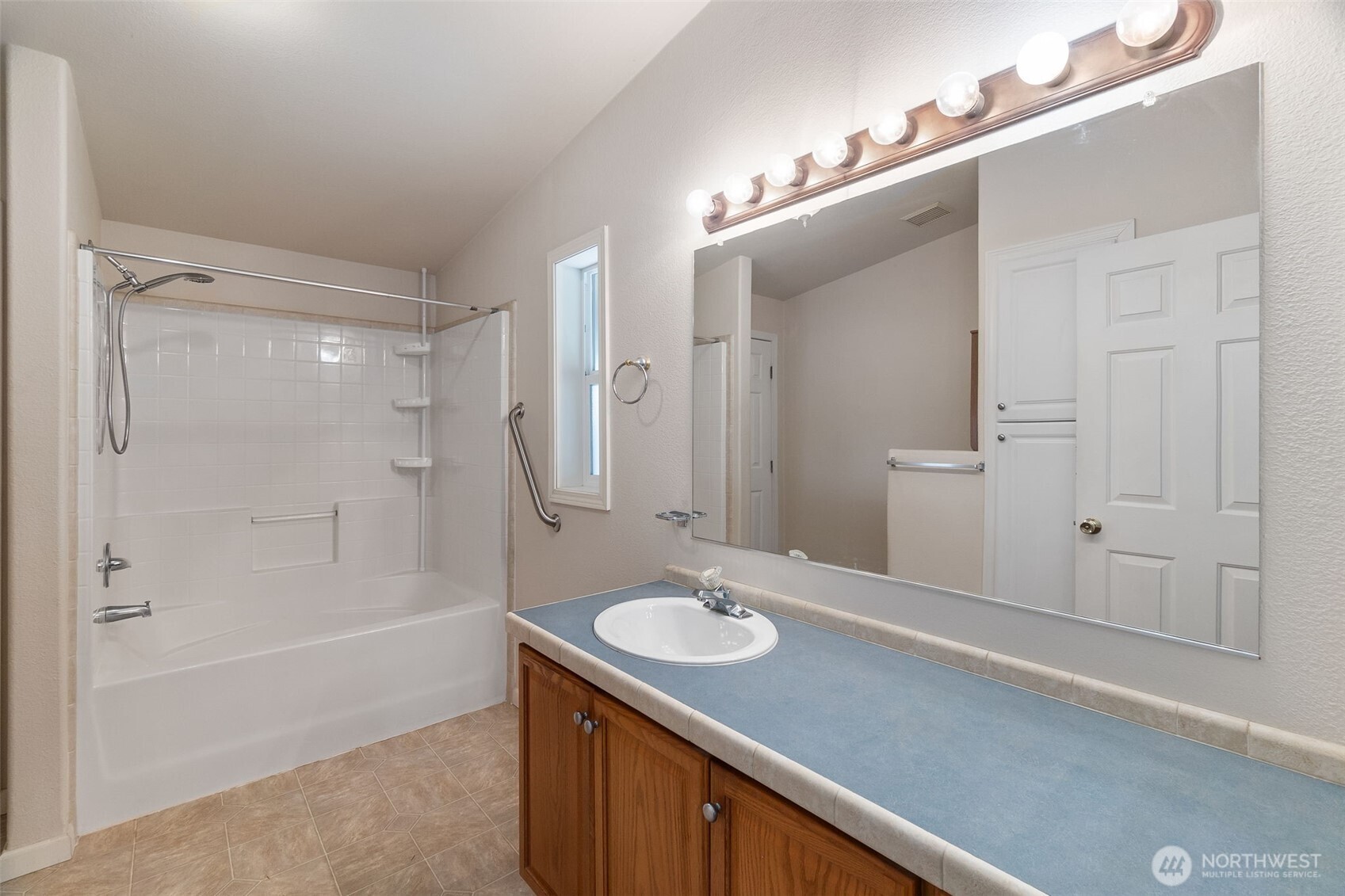 271 Romerman Road, Unit 22 Chehalis, WA 98532 - Photo 16 of 27 a bathroom with a sink a shower and a mirror