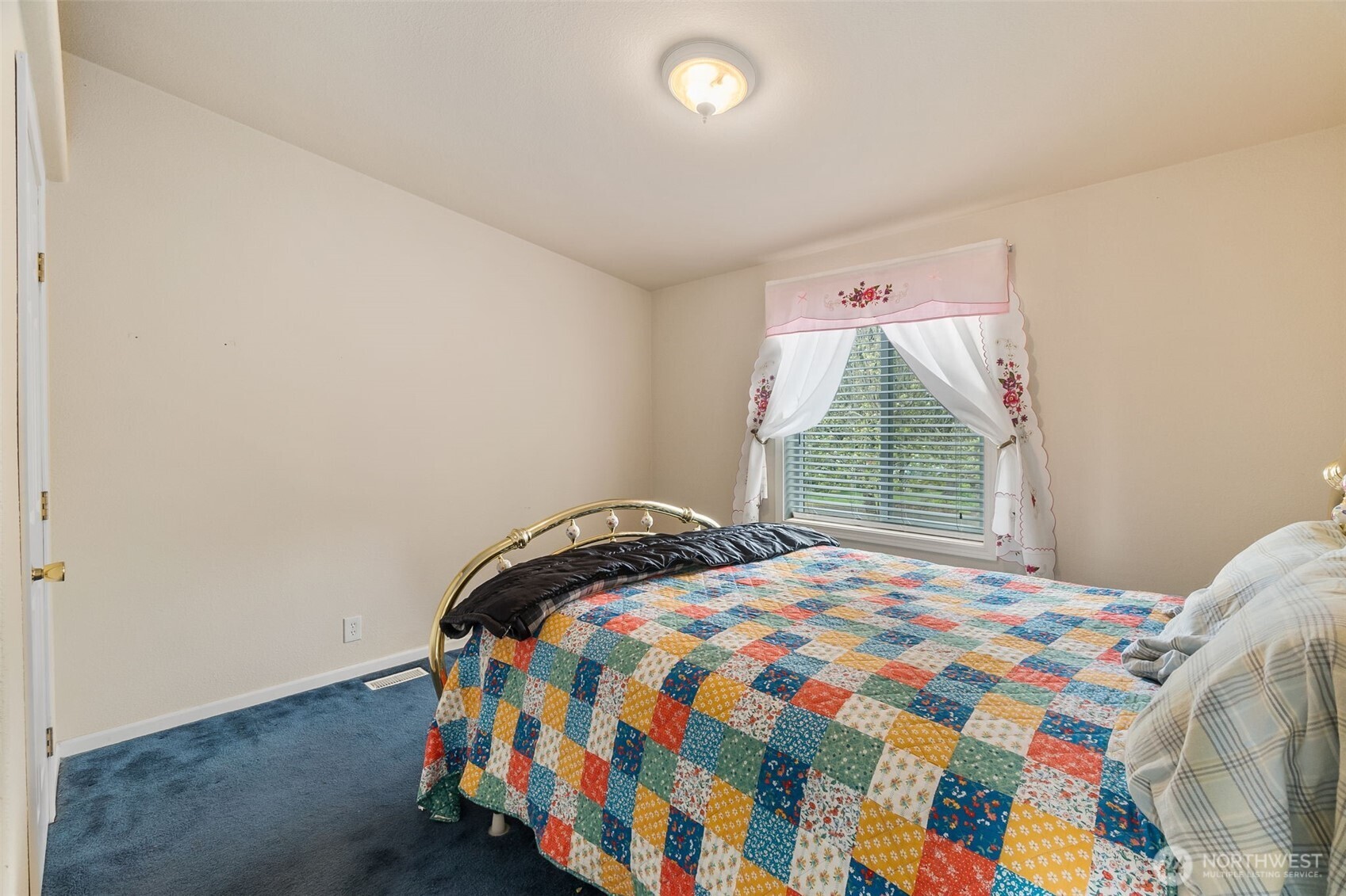 271 Romerman Road, Unit 22 Chehalis, WA 98532 - Photo 19 of 27 a bedroom with a bed and a window