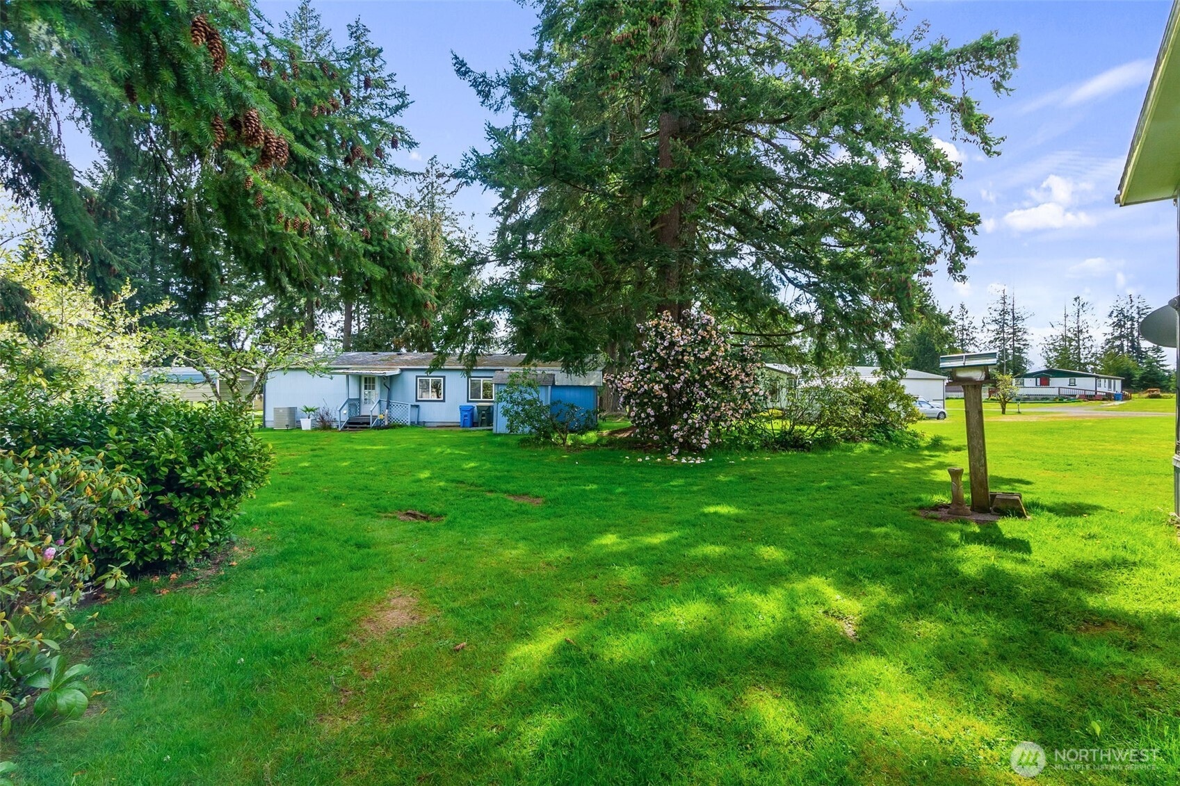 271 Romerman Road, Unit 22 Chehalis, WA 98532 - Photo 24 of 27 a view of a house with a backyard