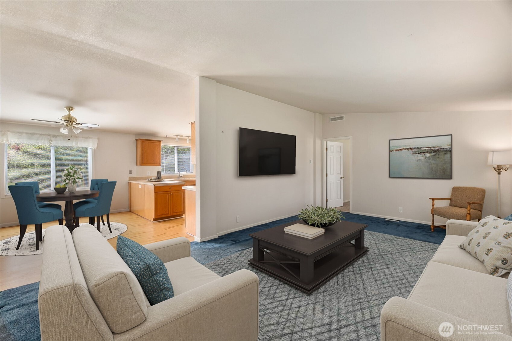 271 Romerman Road, Unit 22 Chehalis, WA 98532 - Photo 10 of 27 a living room with furniture a rug and a flat screen tv