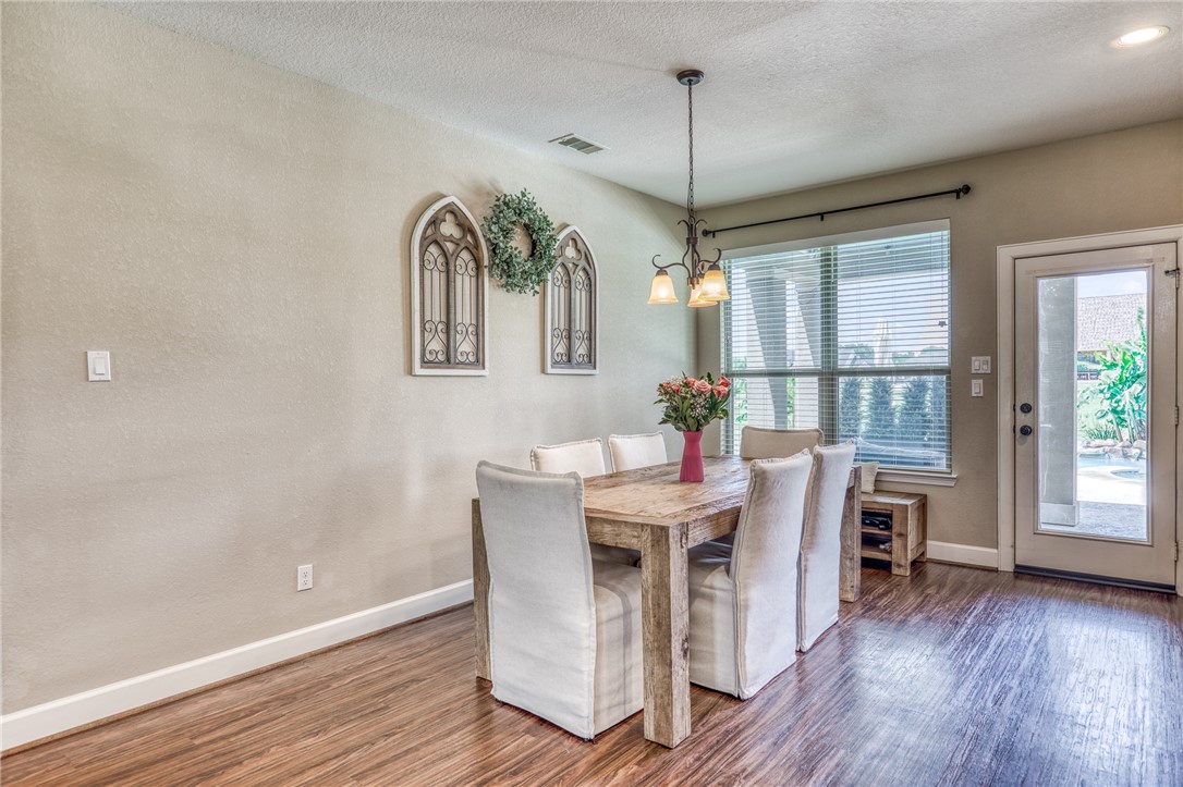 586 Ruby Drive Bellville, TX 77418 - Photo 10 of 50 a view of a dining room with furniture window and wooden floor