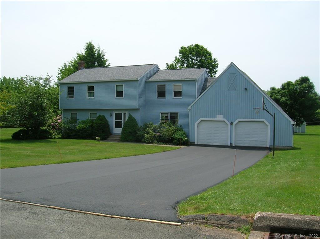 25 Whisper Wind Road Middlefield, CT 06455 - Photo 1 of 1 a front view of a house with garden