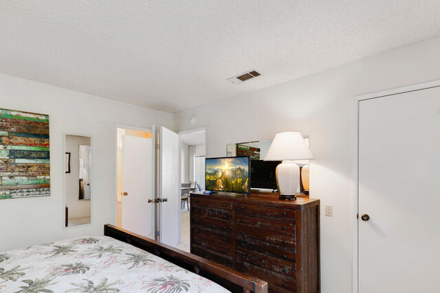 1150 East Amado Road, Unit 8A2 Palm Springs, CA 92262 - Photo 19 of 21 good size bedroom