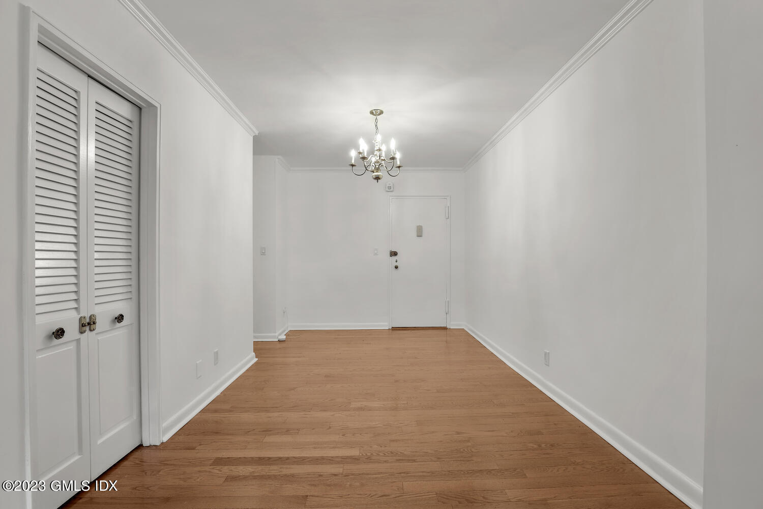 2 Putnam Hill, Unit 1C Greenwich, CT 06830 - Photo 2 of 13 a view of a chandelier in an empty room