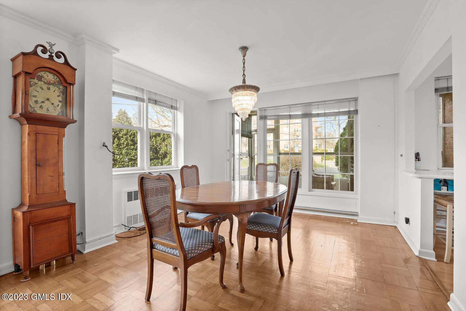 2 Putnam Hill, Unit 1C Greenwich, CT 06830 - Photo 5 of 13 a dining room with furniture a chandelier and wooden floor