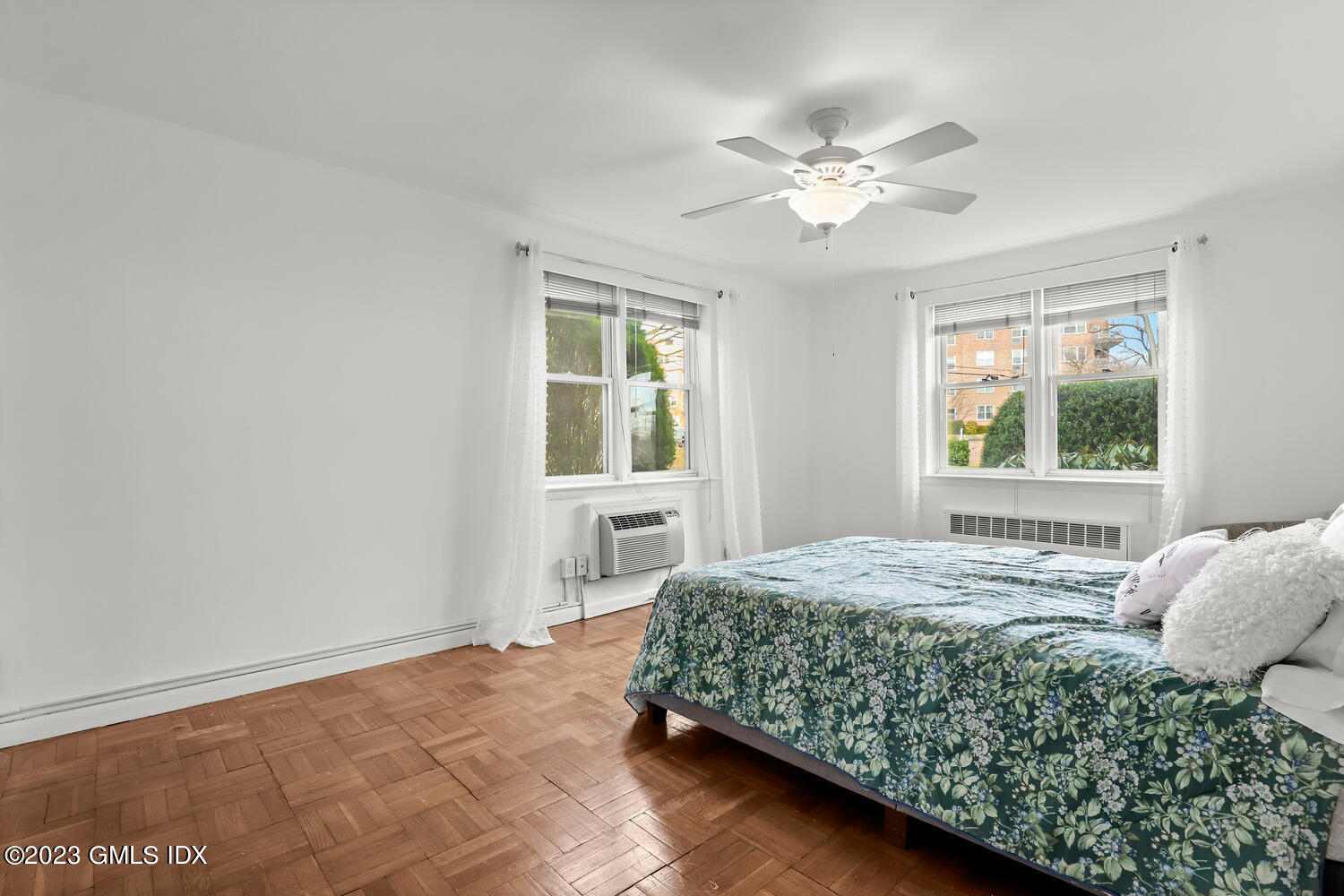 2 Putnam Hill, Unit 1C Greenwich, CT 06830 - Photo 7 of 13 a bedroom with a large bed and a window