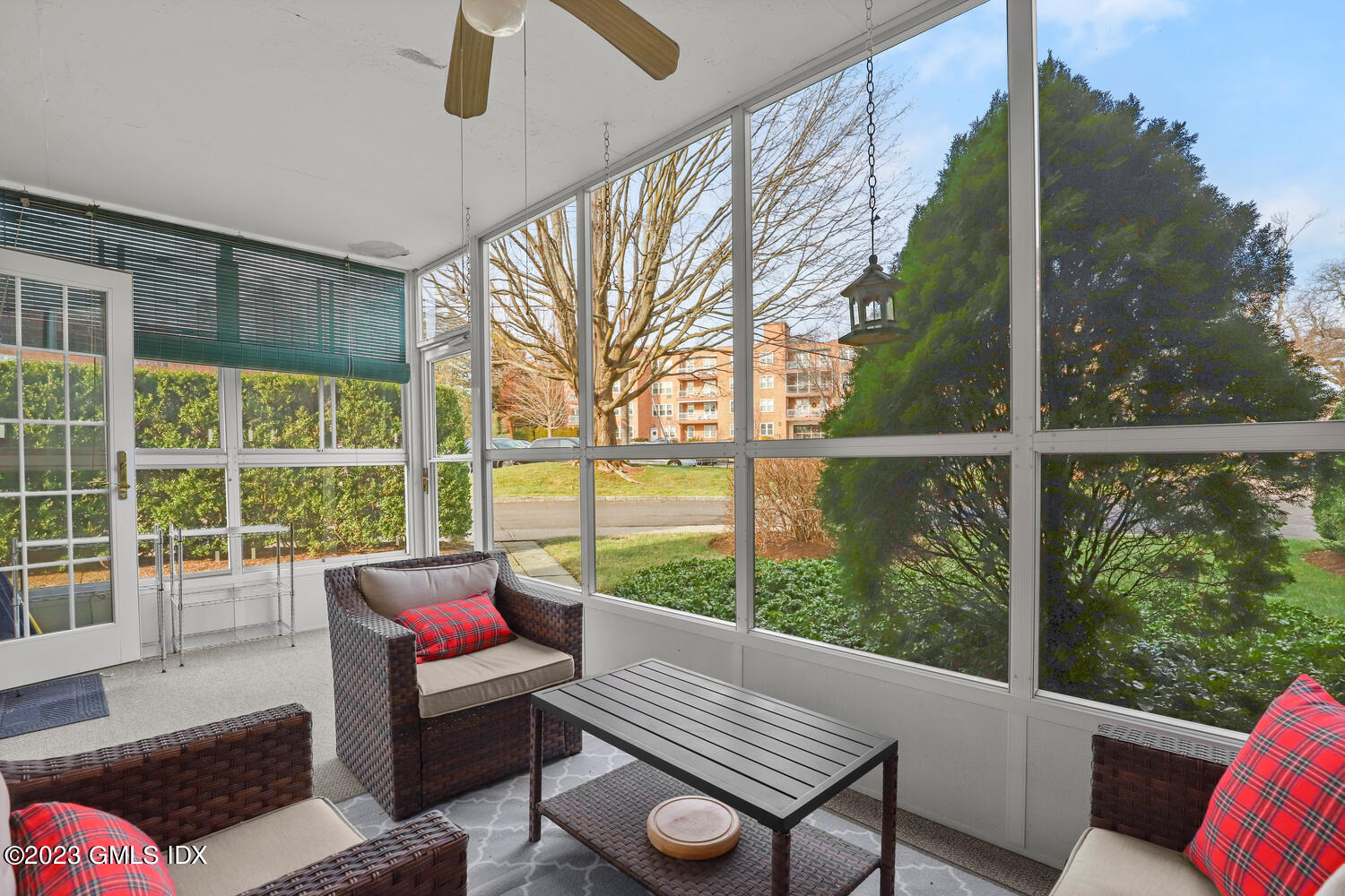 2 Putnam Hill, Unit 1C Greenwich, CT 06830 - Photo 8 of 13 a living room with furniture and a floor to ceiling window