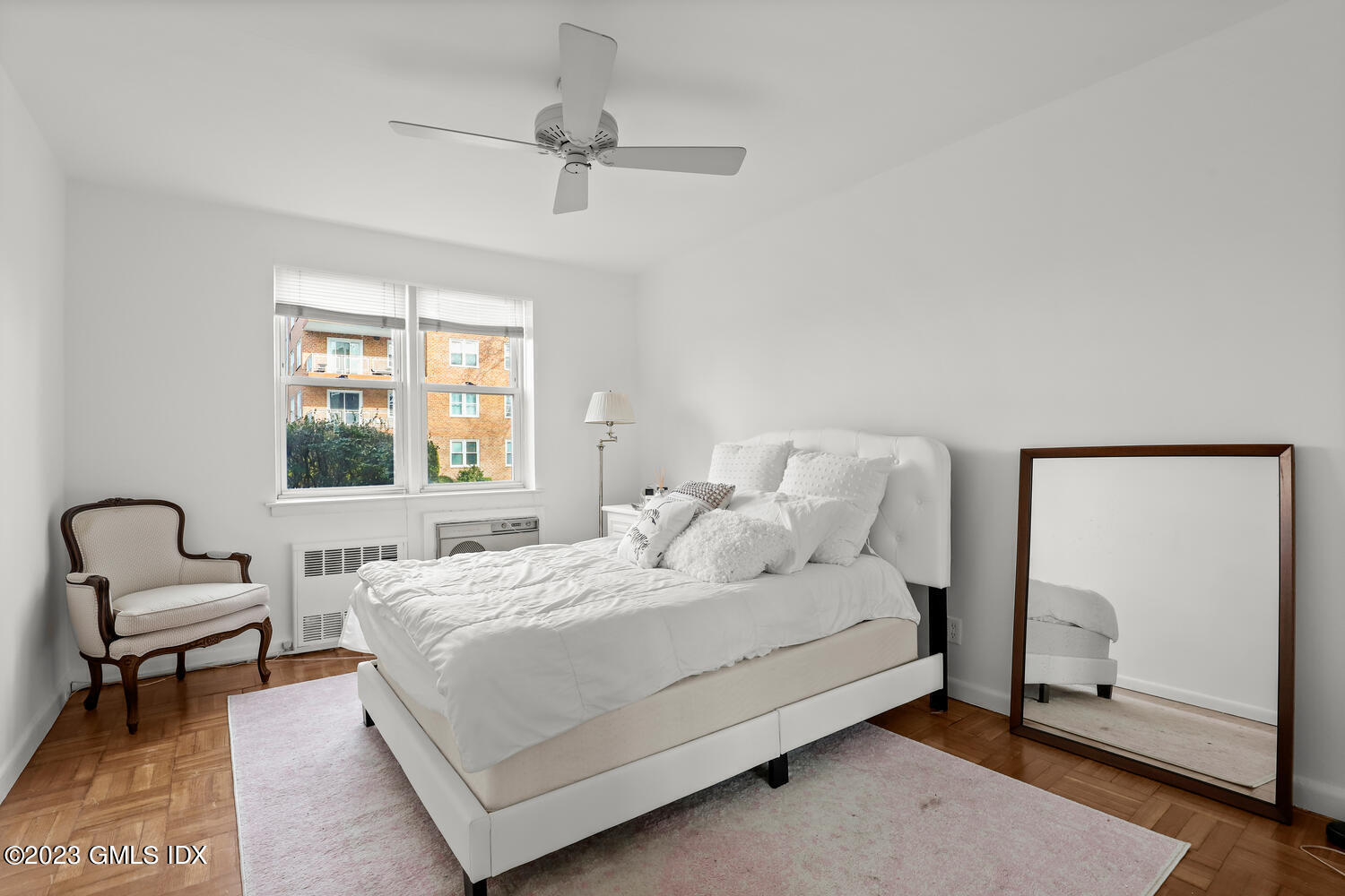 2 Putnam Hill, Unit 1C Greenwich, CT 06830 - Photo 10 of 13 a bedroom with a bed and a window