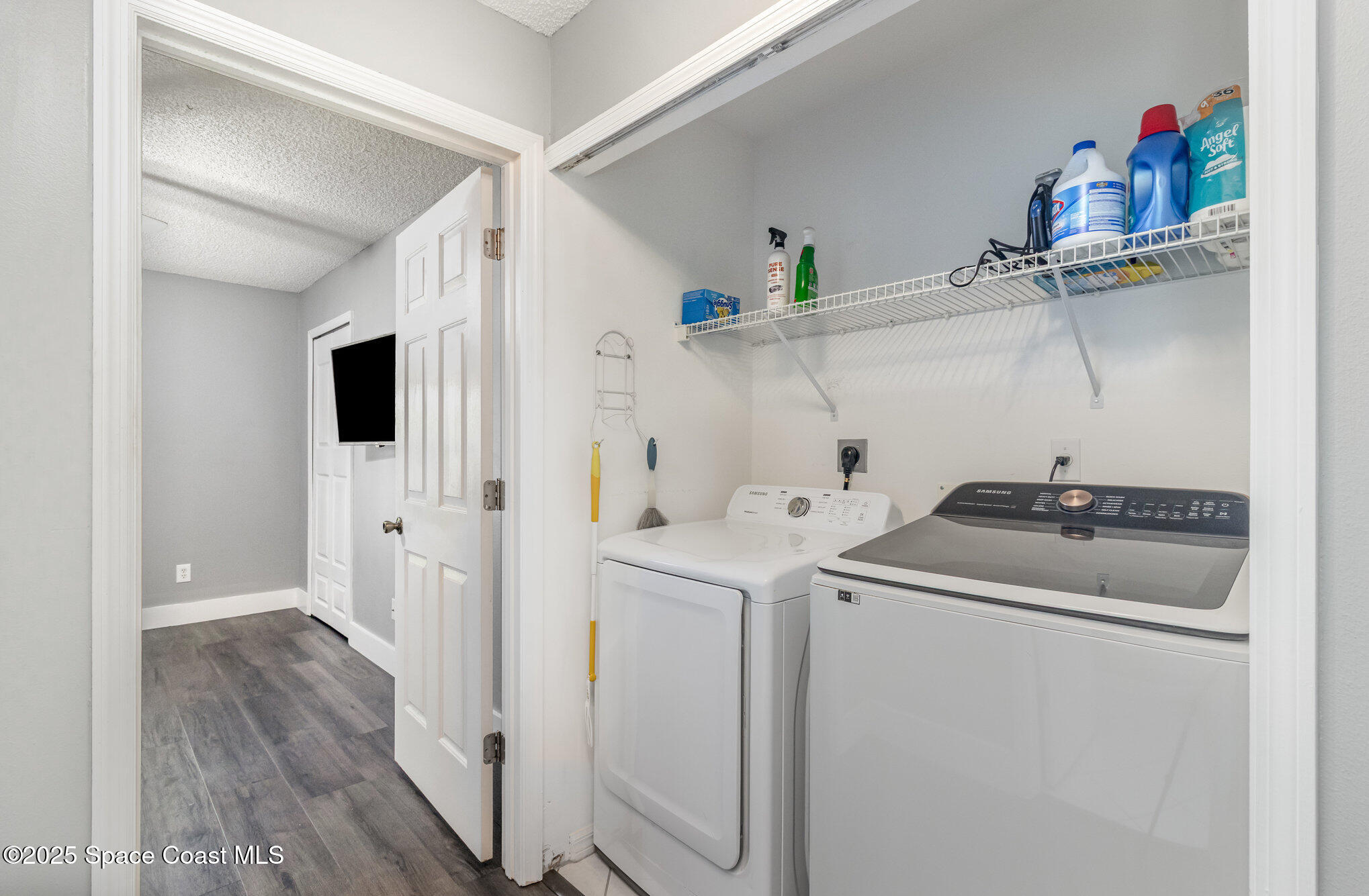 561 Carnival Terrace Sebastian, FL 32958 - Photo 19 of 28 a view of storage and utility room with washer and dryer