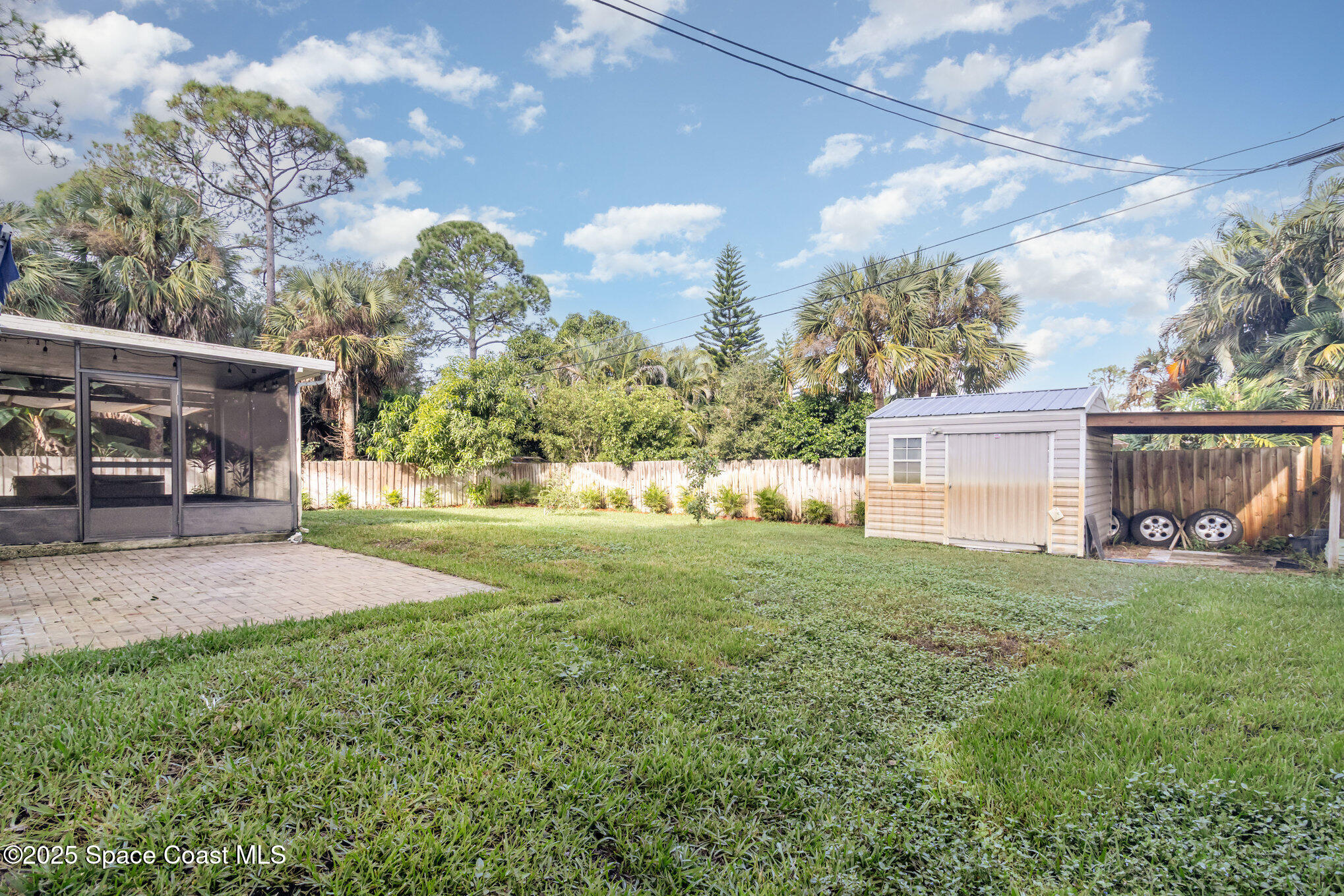 561 Carnival Terrace Sebastian, FL 32958 - Photo 22 of 28 a view of a house with backyard and a tree