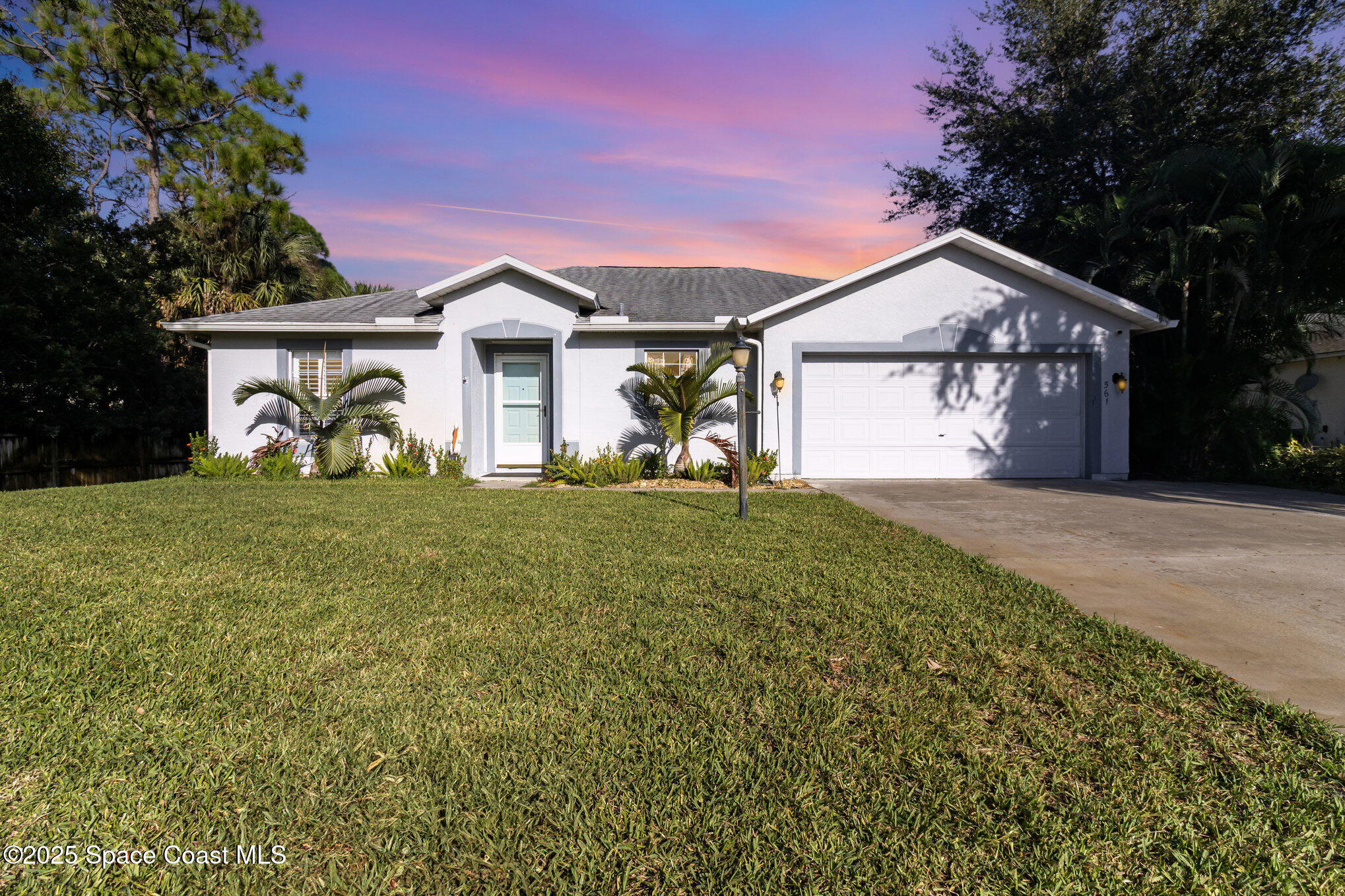 561 Carnival Terrace Sebastian, FL 32958 - Photo 24 of 28 a front view of a house with garden