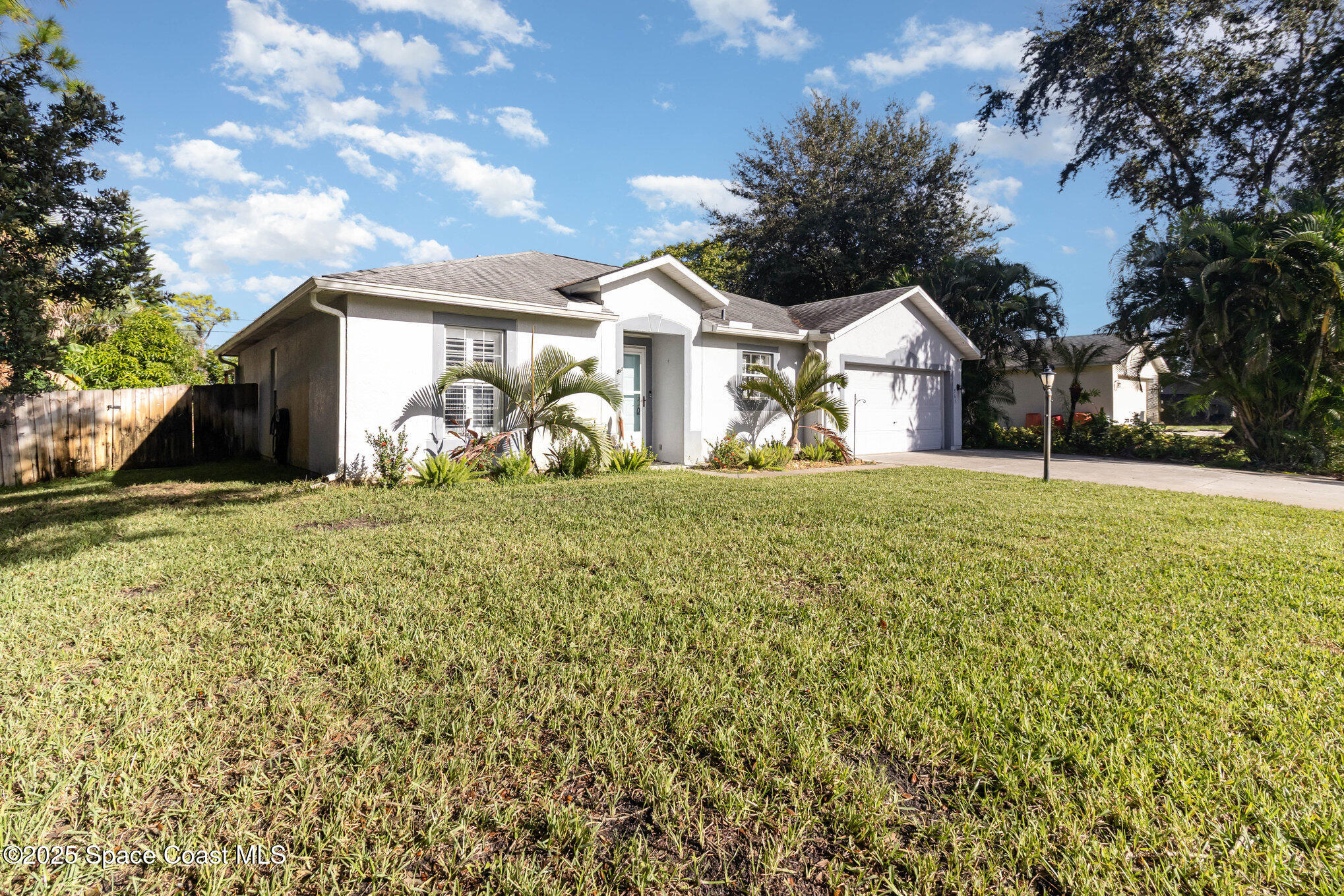 561 Carnival Terrace Sebastian, FL 32958 - Photo 25 of 28 a front view of a house with a yard