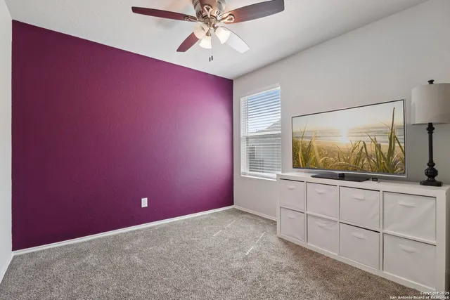 a room with window and a ceiling fan