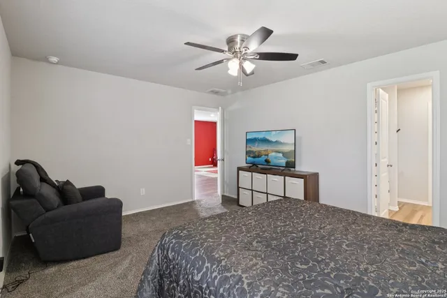 a bedroom with a bed and a dresser