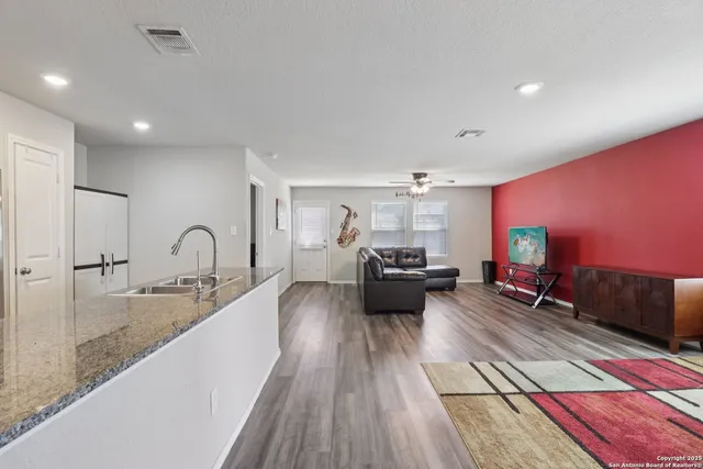 a large room with lots of counter space and bed