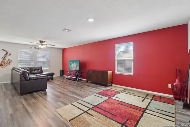 a living room with furniture and a couch