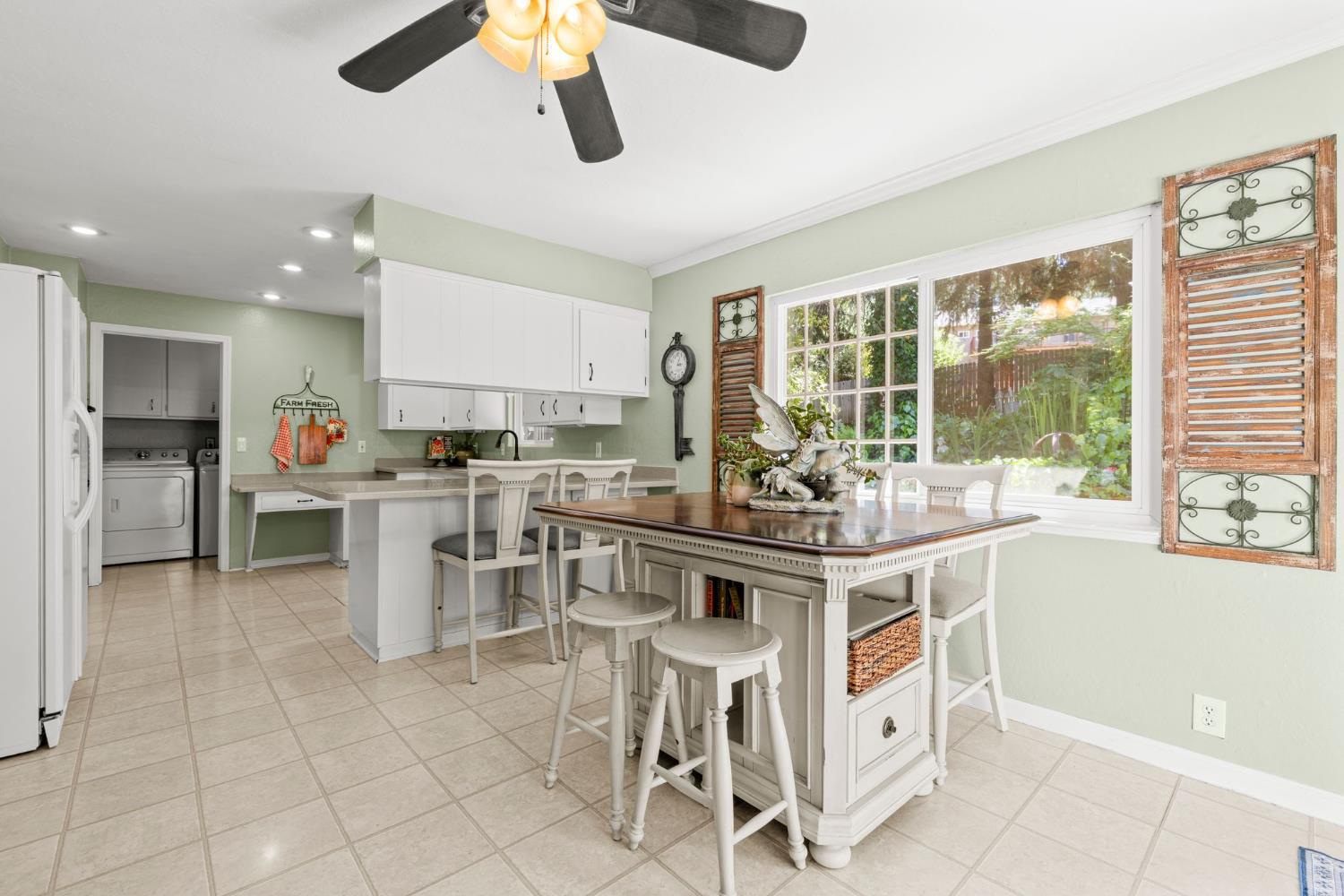 2812 Crystal Springs Road Camino, CA 95709 - Photo 13 of 28 a kitchen with stainless steel appliances granite countertop a stove top oven a sink dishwasher and white cabinets next to a window