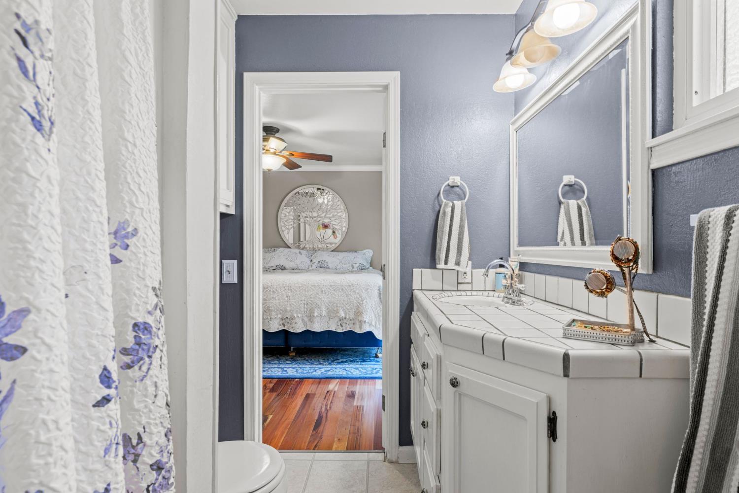 2812 Crystal Springs Road Camino, CA 95709 - Photo 18 of 28 a en suite bathroom with a sink and a mirror