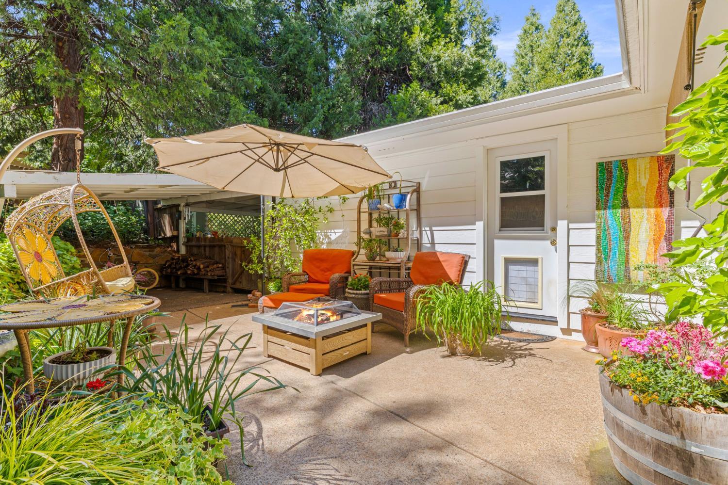 2812 Crystal Springs Road Camino, CA 95709 - Photo 20 of 28 a view of a patio with chairs and potted plants