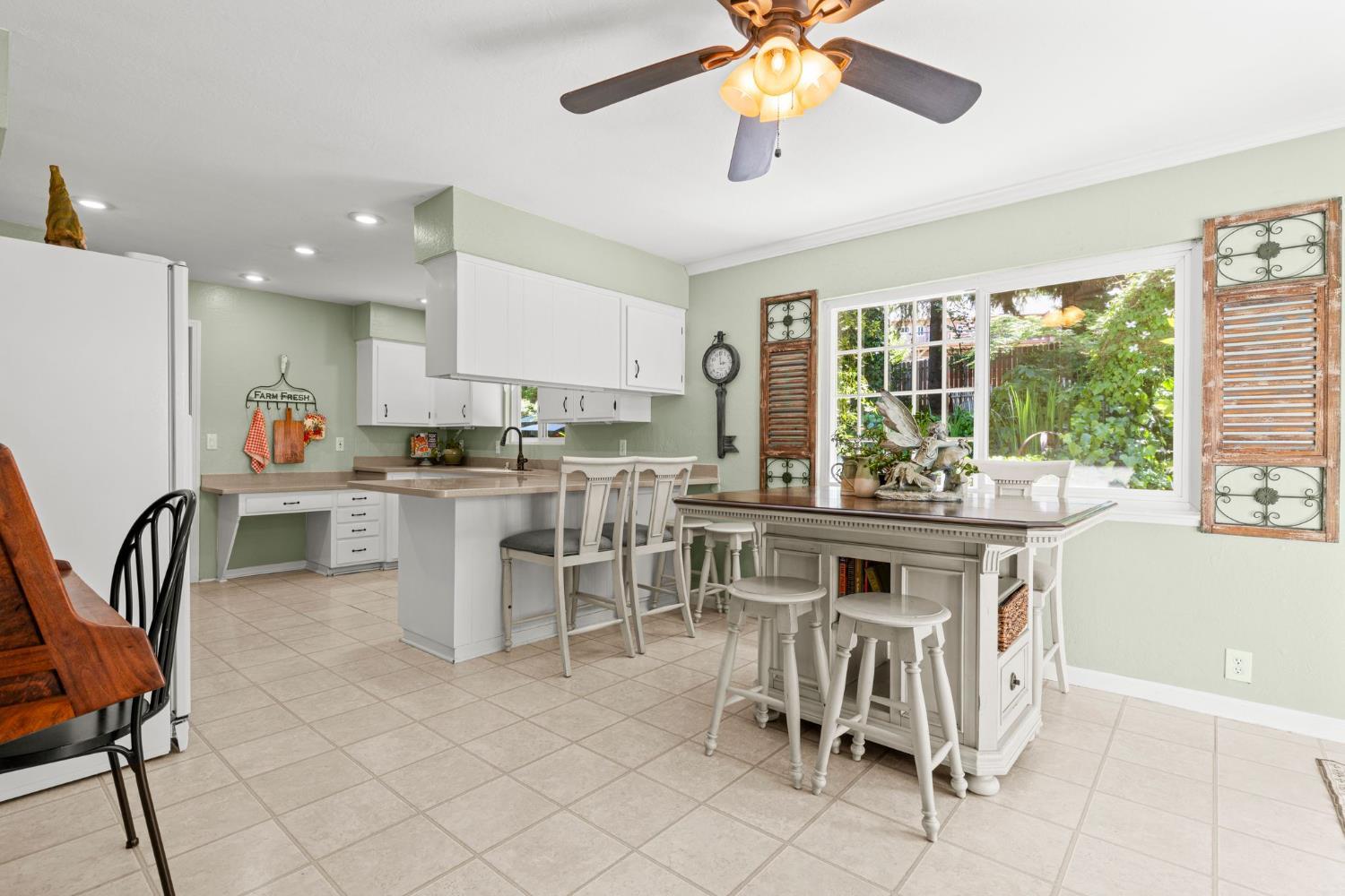 2812 Crystal Springs Road Camino, CA 95709 - Photo 10 of 28 a kitchen with a dining table chairs and white appliances