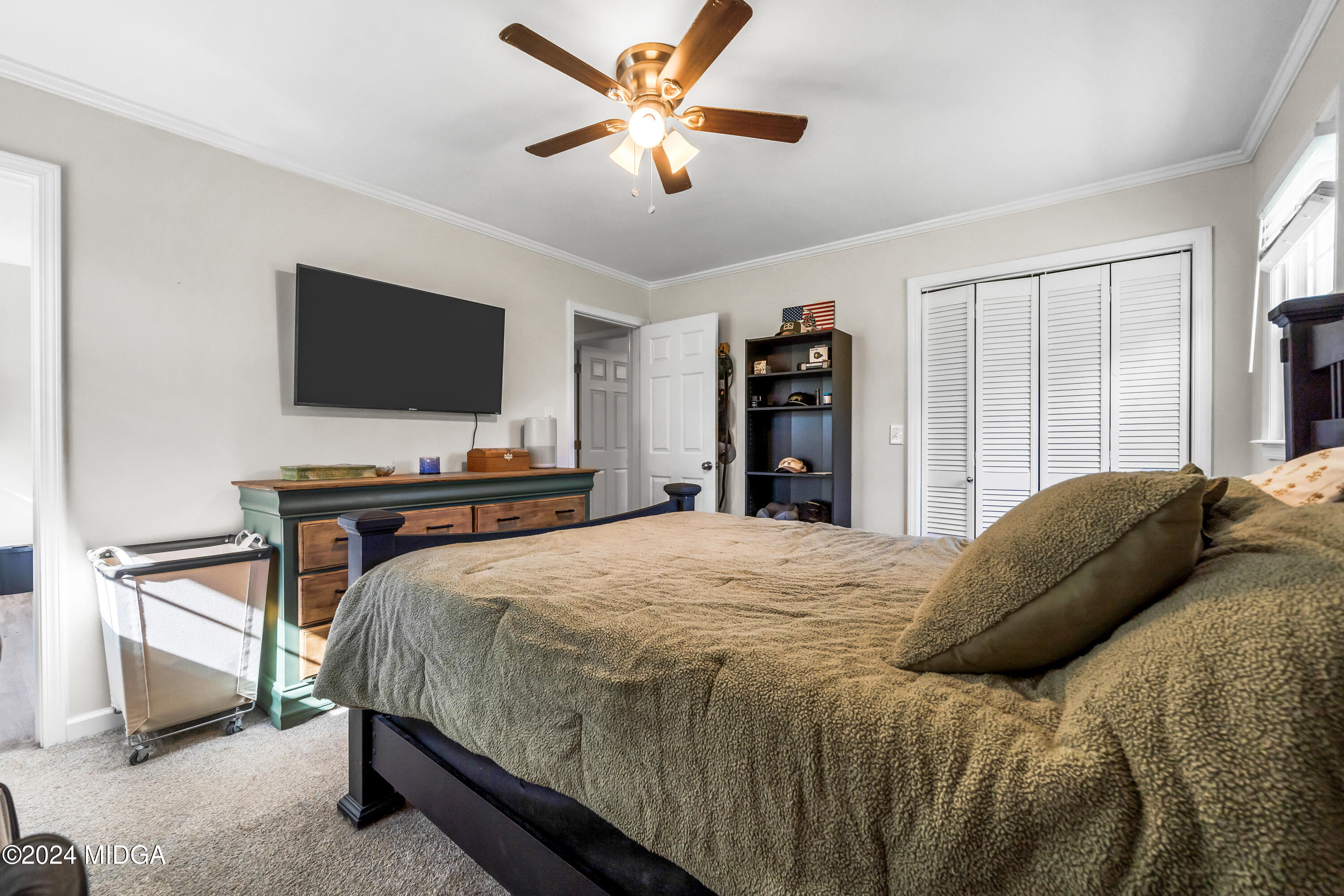 251 Buck Road Gray, GA 31032 - Photo 15 of 54 a bedroom with a bed and a flat screen tv