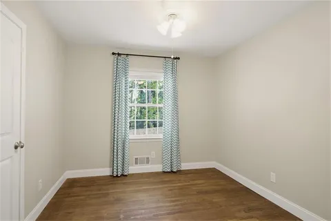 a bathroom with a window and shower