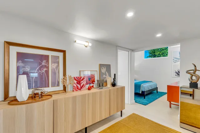 aerial view of a house with a yard and furniture