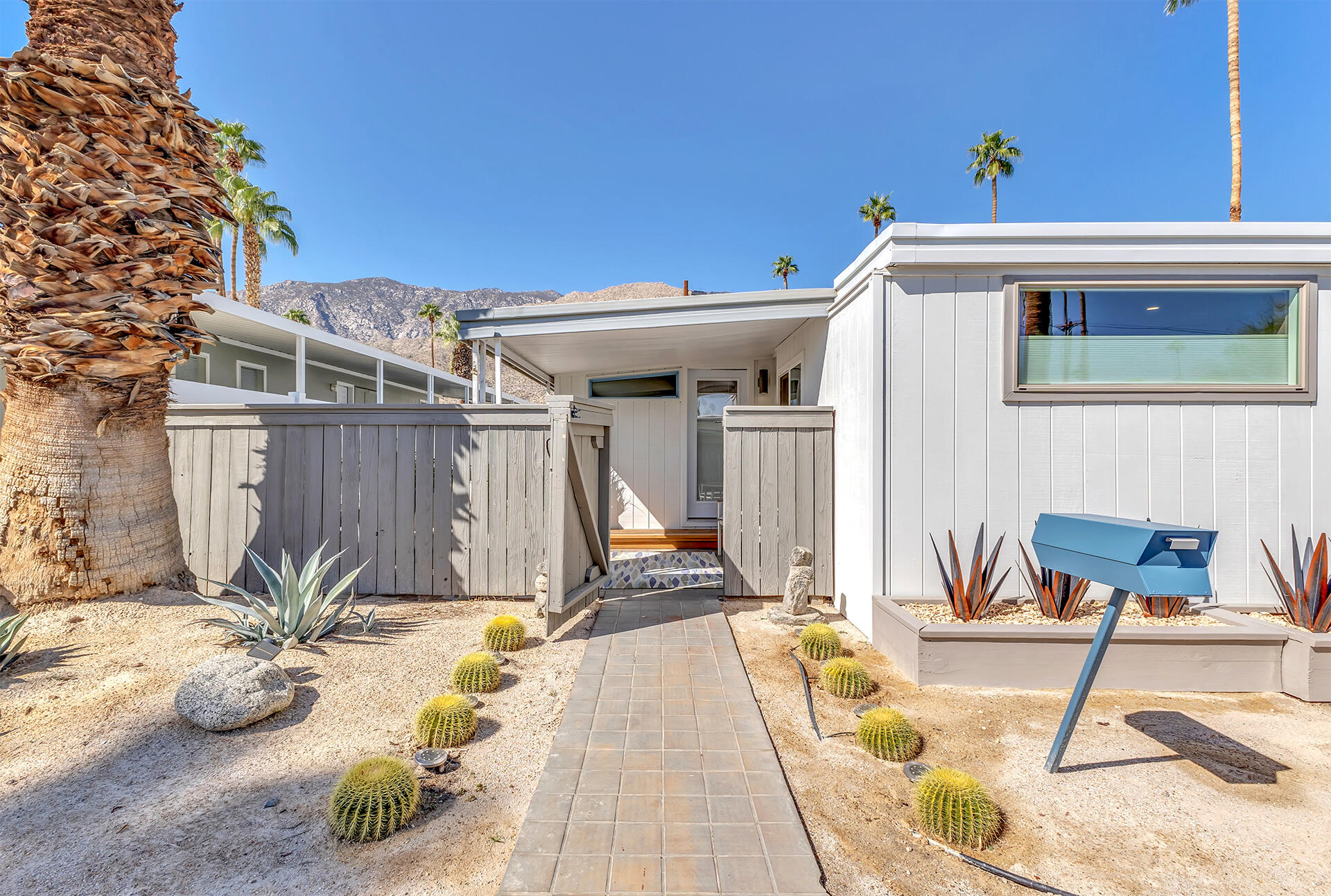 69 Nile Street Palm Springs, CA 92264 - Photo 23 of 68 a view of a patio with a table and chairs