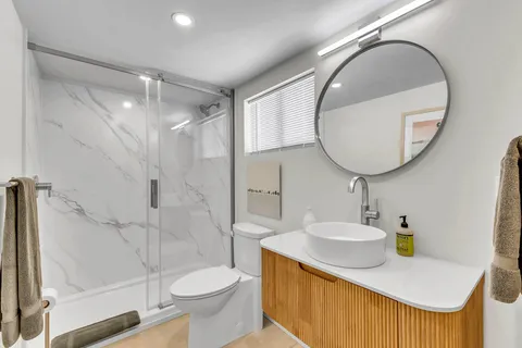 a view of an outdoor sitting area with brick walls