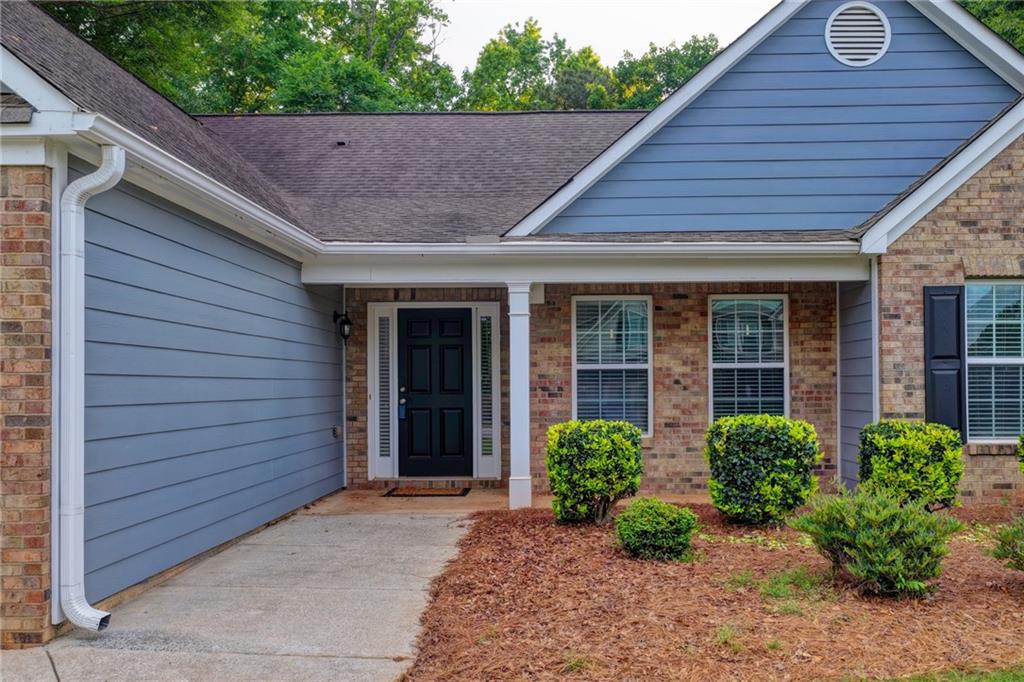 310 Andrew Ridge Drive Jefferson, GA 30549 - Photo 2 of 52 a front view of a house with garden