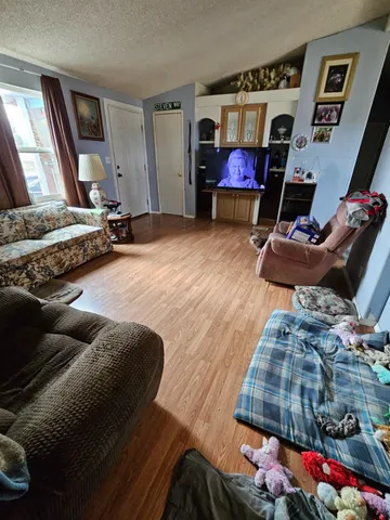 a bedroom with bed and a window