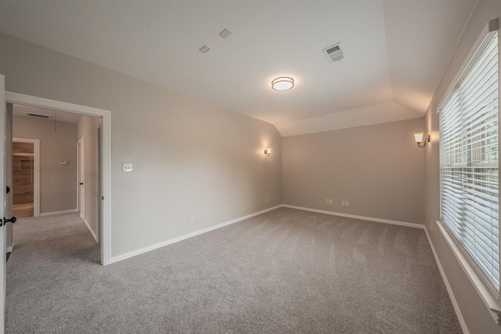 412 Hideaway Road McKinney, TX 75072 - Photo 38 of 40 an empty room with a empty space and windows