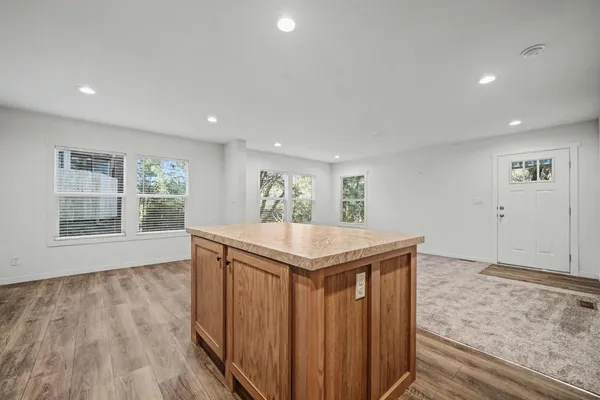 a view of kitchen and wooden floor