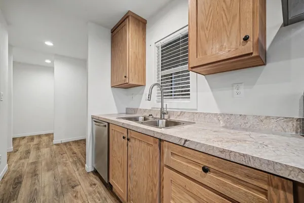 a kitchen with a sink and cabinets