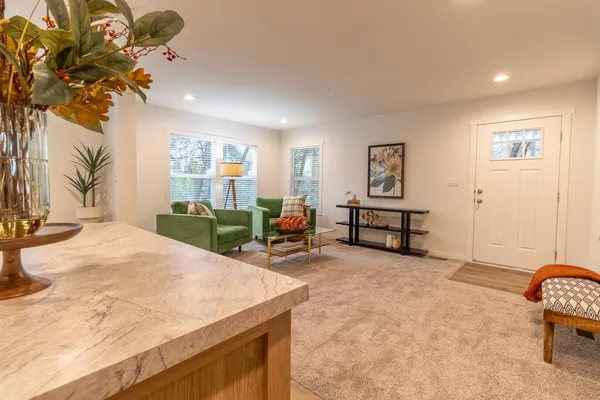 a view of a livingroom with furniture and a couch