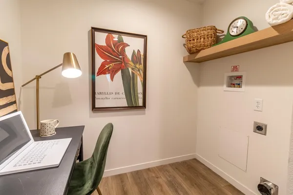 a view of dining room with a table and chairs