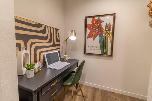 a view of a workspace with furniture